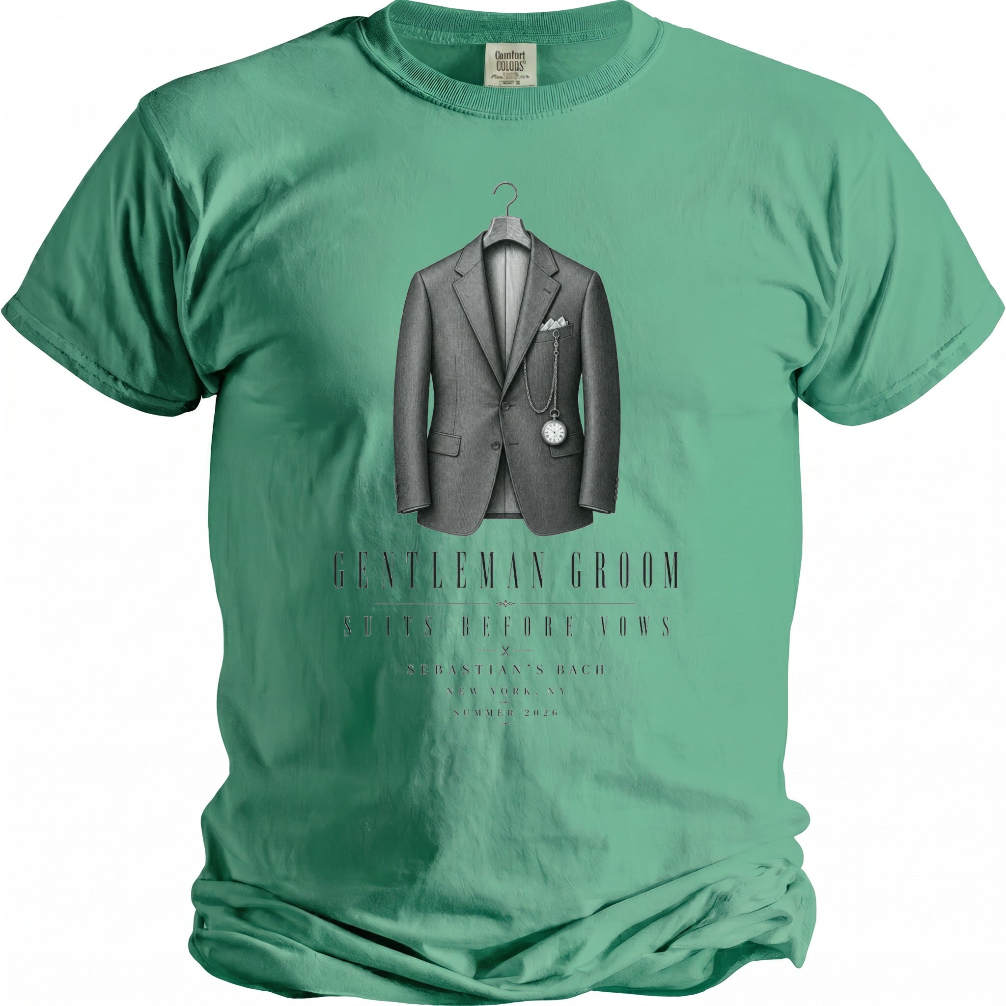 Green t-shirt with illustration of a grey suit, pocket watch, and text.