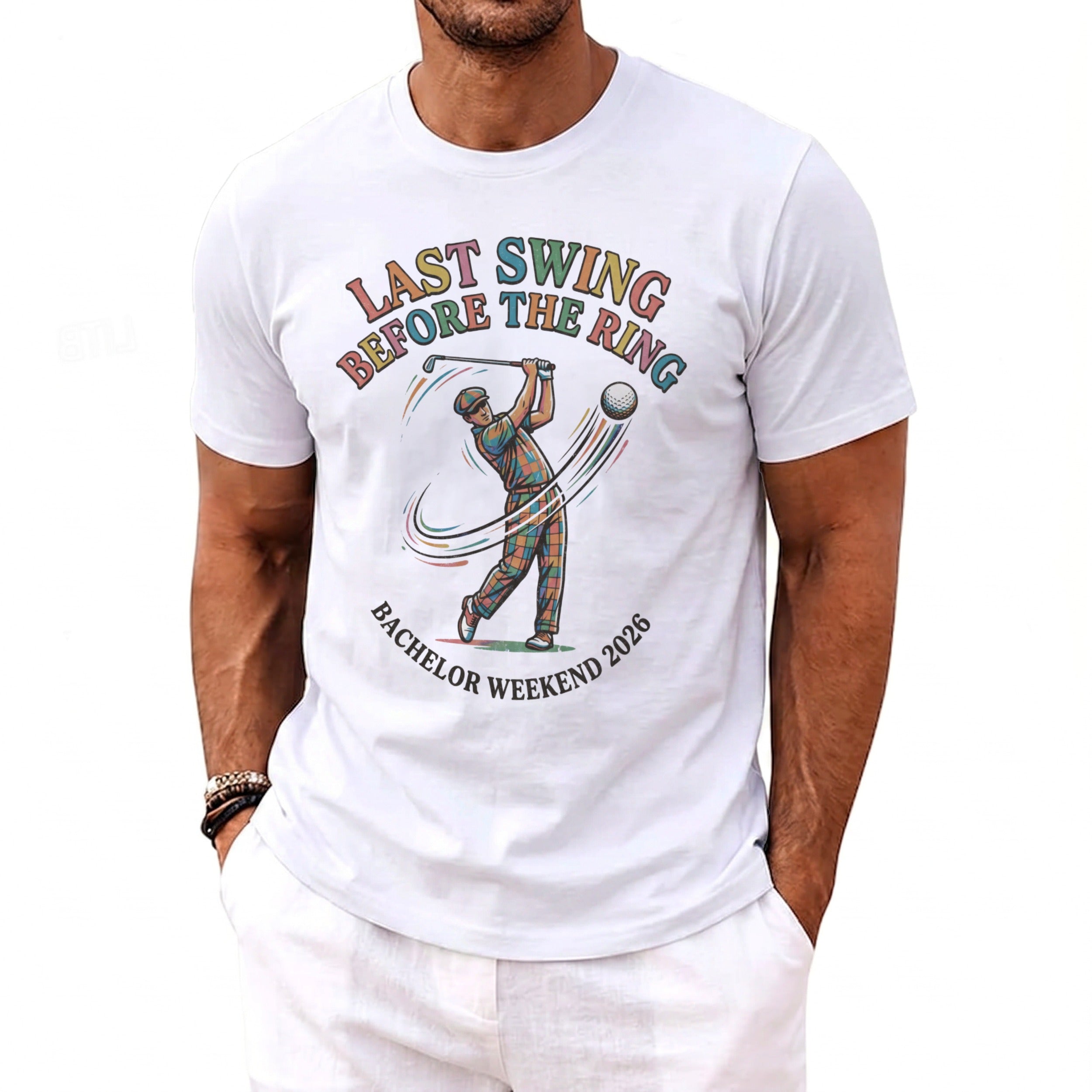 White t-shirt with "LAST SWING BEFORE THE RING BACHELOR WEEKEND 2026" graphic.