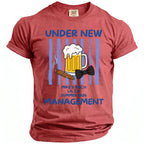 Red t-shirt with graphic. Text reads "Under New Management" and "Mike's Bach LA, CA Summer 2026."