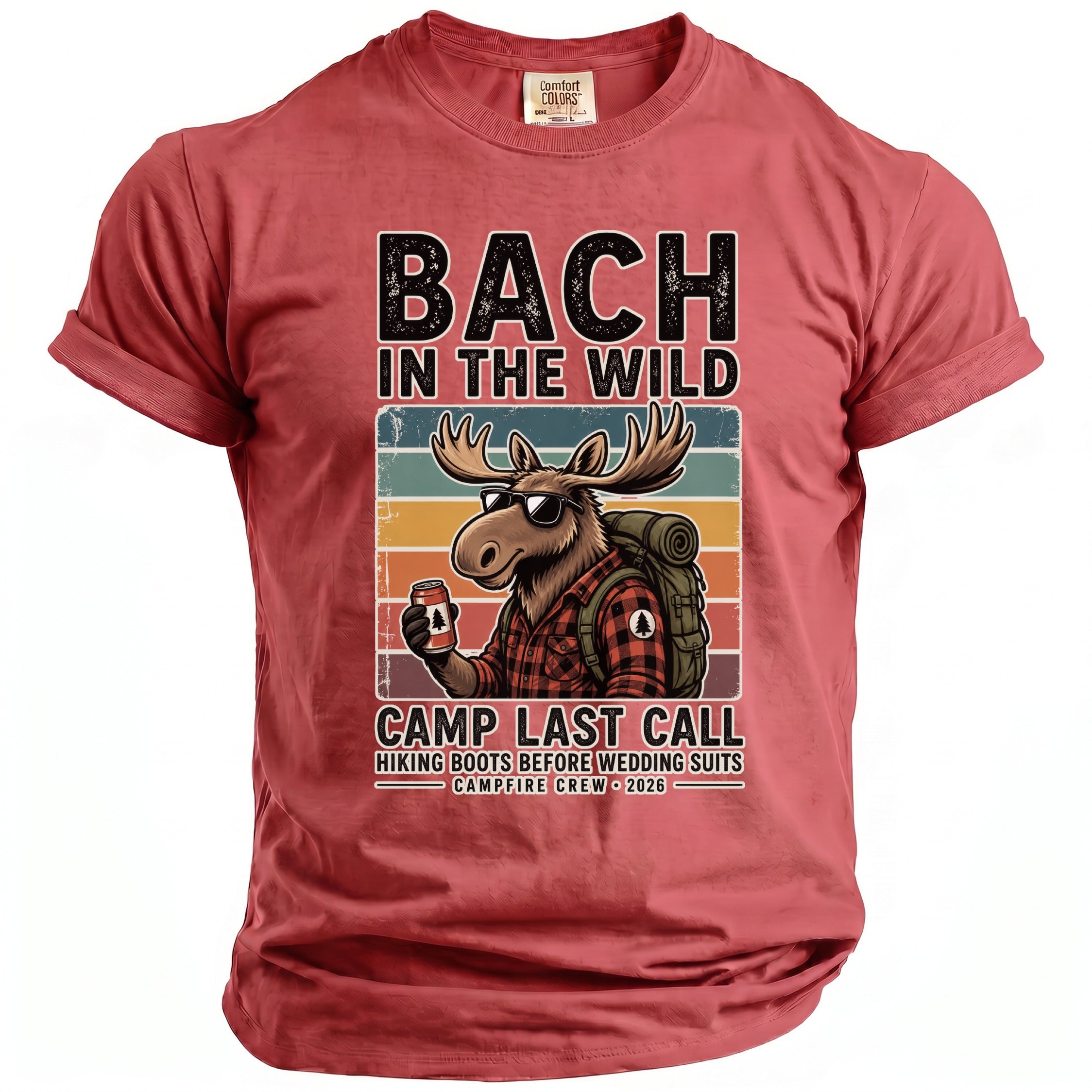Red t-shirt with distressed graphic: moose with sunglasses, backpack, and can. Text reads "BACH IN THE WILD CAMP LAST CALL".