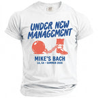 White t-shirt with "UNDER NEW MANAGEMENT MIKE'S BACH LA, CA SUMMER 2026" and graphics.