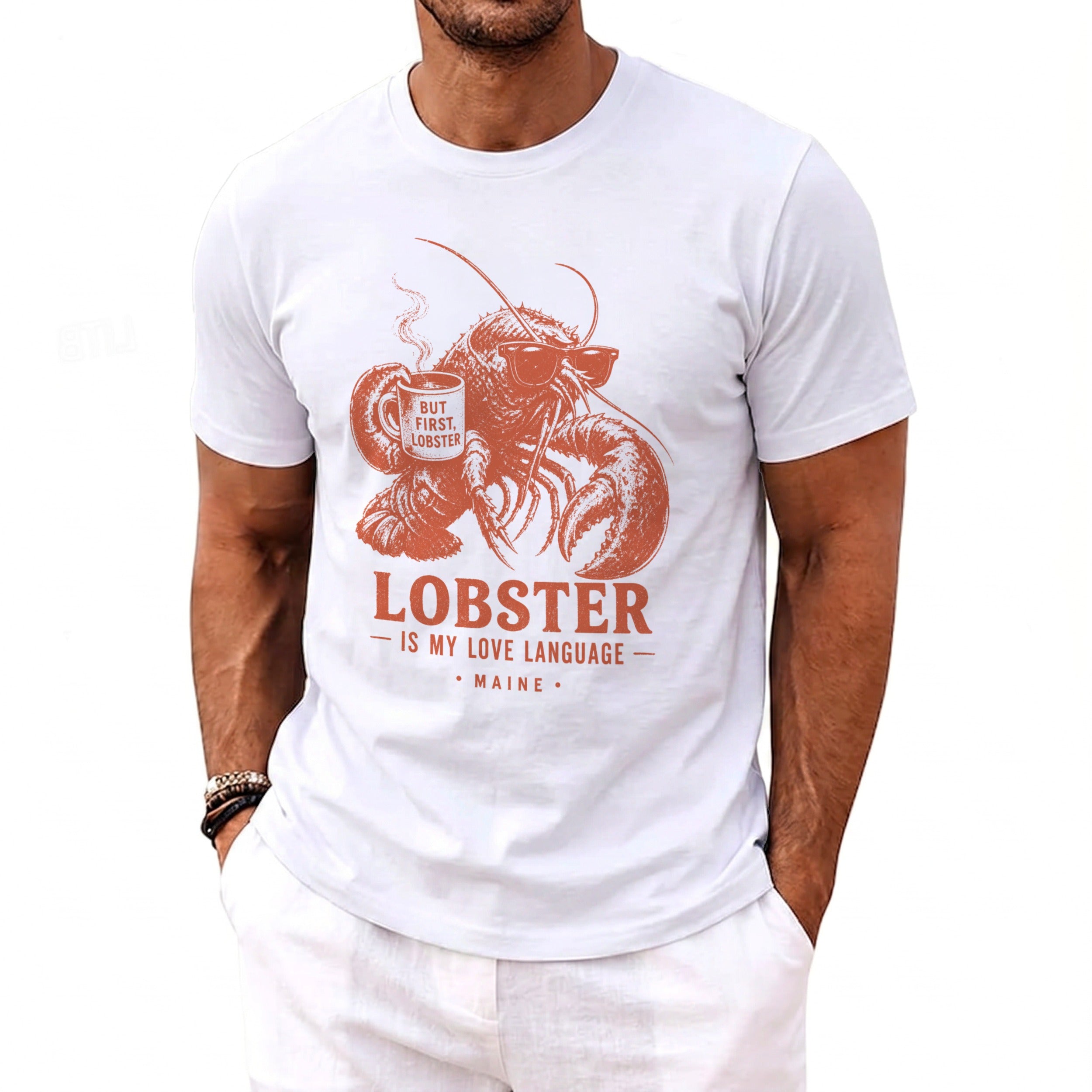 White t-shirt with graphic of lobster wearing sunglasses holding coffee cup and text "Lobster is my love language"
