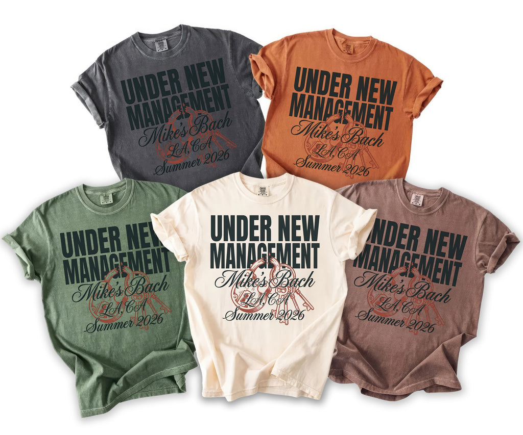 Five t-shirts in various colors featuring "Under New Management Mike's Bach LA, CA Summer 2026" text.
