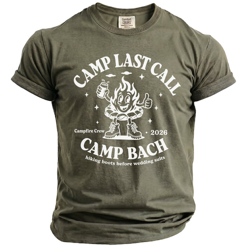 An olive green t-shirt with white graphic text reading Camp Last Call and Camp Bach.