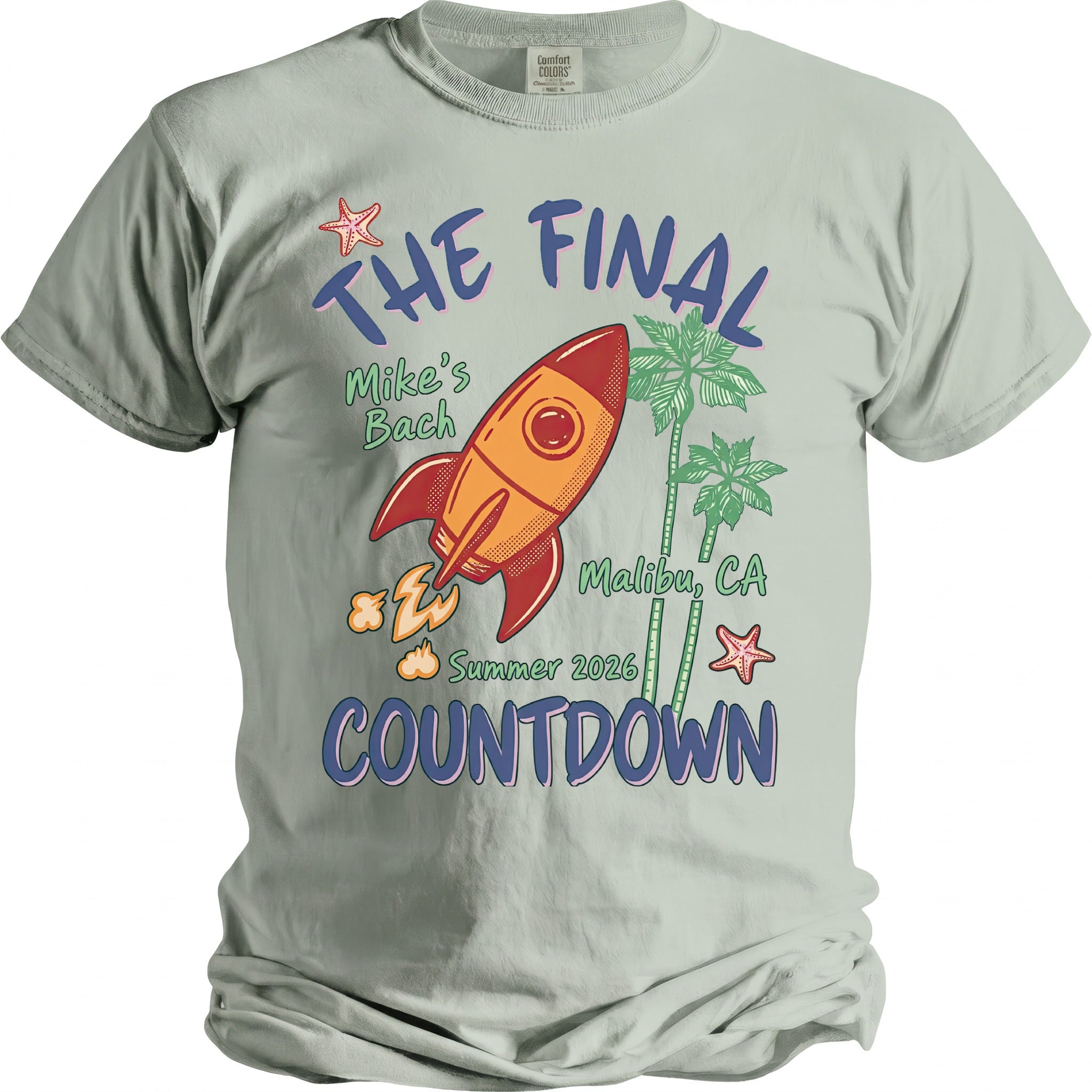 Light grey t-shirt with "The Final Countdown" graphic featuring a rocket, palm trees, and starfish.