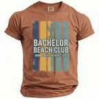 Brown t-shirt with "Bachelor Beach Club Groom's Beach Weekend - 2026" text.