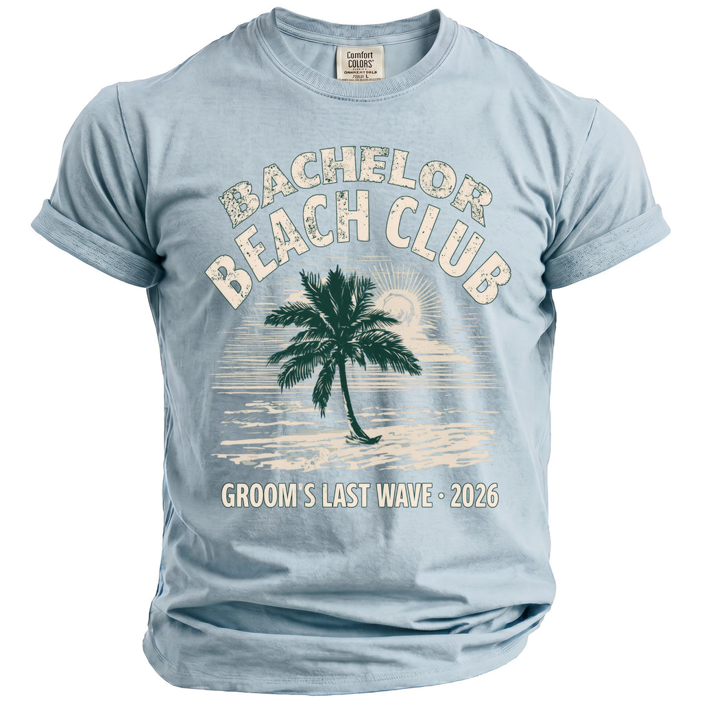 Light blue Comfort Colors t-shirt with "Bachelor Beach Club Groom's Last Wave 2026" text.