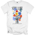 White t-shirt with "STILL LIFE" and floral art with paintbrushes in a jar.