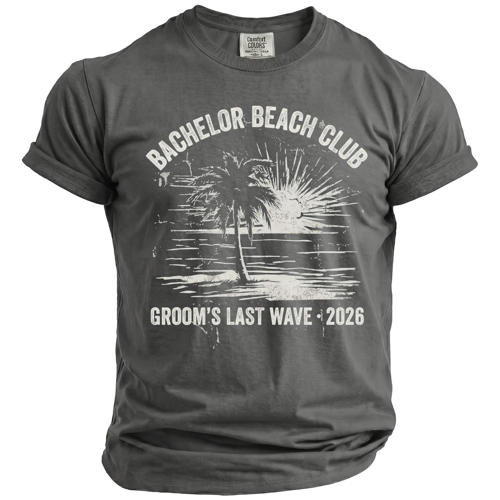 Comfort Colors t-shirt with "Bachelor Beach Club Groom's Last Wave 2026" and beach graphic.