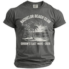 Comfort Colors t-shirt with "Bachelor Beach Club Groom's Last Wave 2026" and beach graphic.