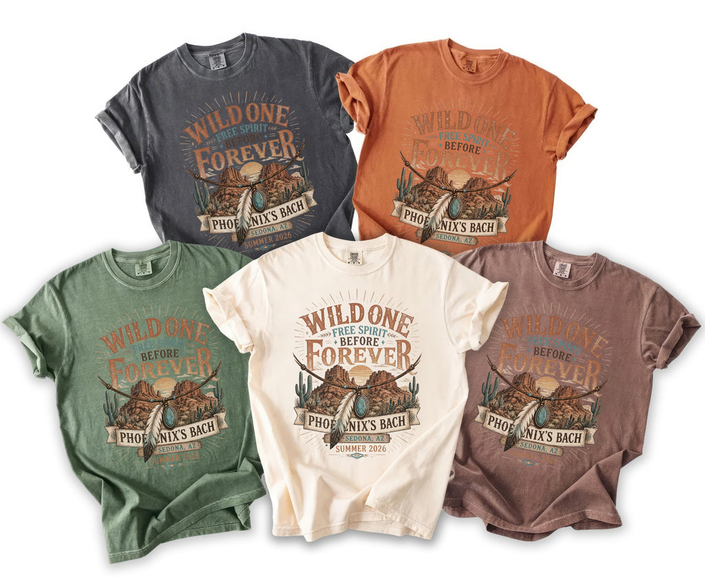 Five t-shirts in different colors featuring "Wild One Free Spirit Before Forever" graphic.