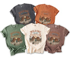 Five t-shirts in different colors featuring "Wild One Free Spirit Before Forever" graphic.