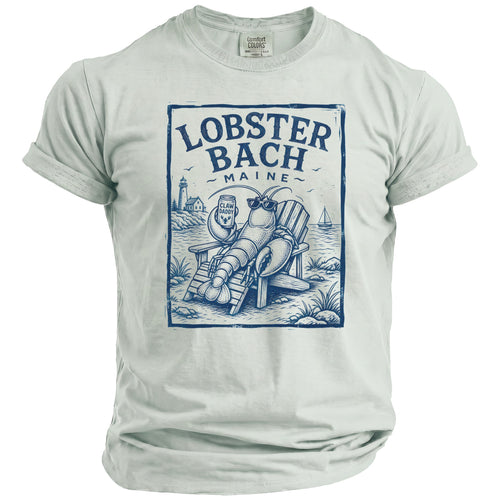T-shirt with blue print of a lobster in a beach chair holding a drink, reading "Lobster Bach Maine."