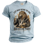 Light blue t-shirt with lion in suit holding champagne for "Bachelor Party".