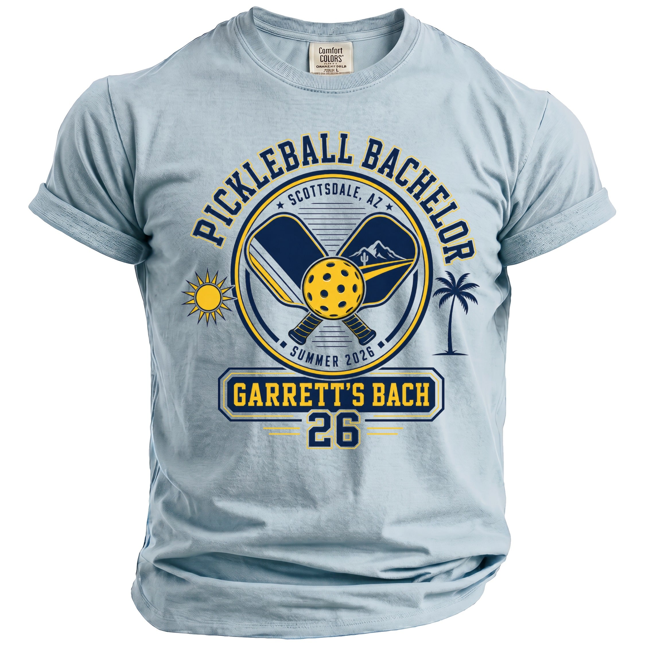 Light blue t-shirt with "Pickleball Bachelor Scottsdale, AZ Summer 2026 Garrett's Bach 26" design.