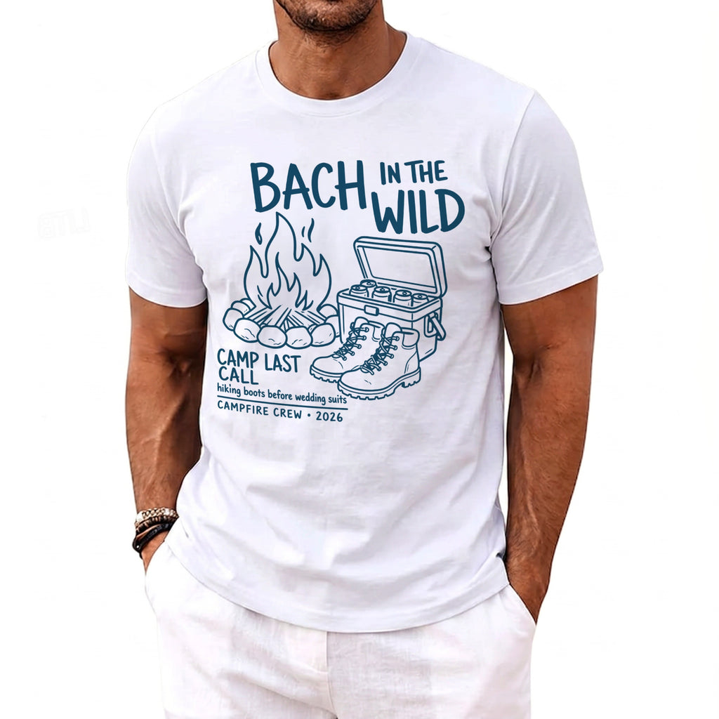White t-shirt with graphic of campfire, cooler, and boots; text reads "Bach in the Wild".