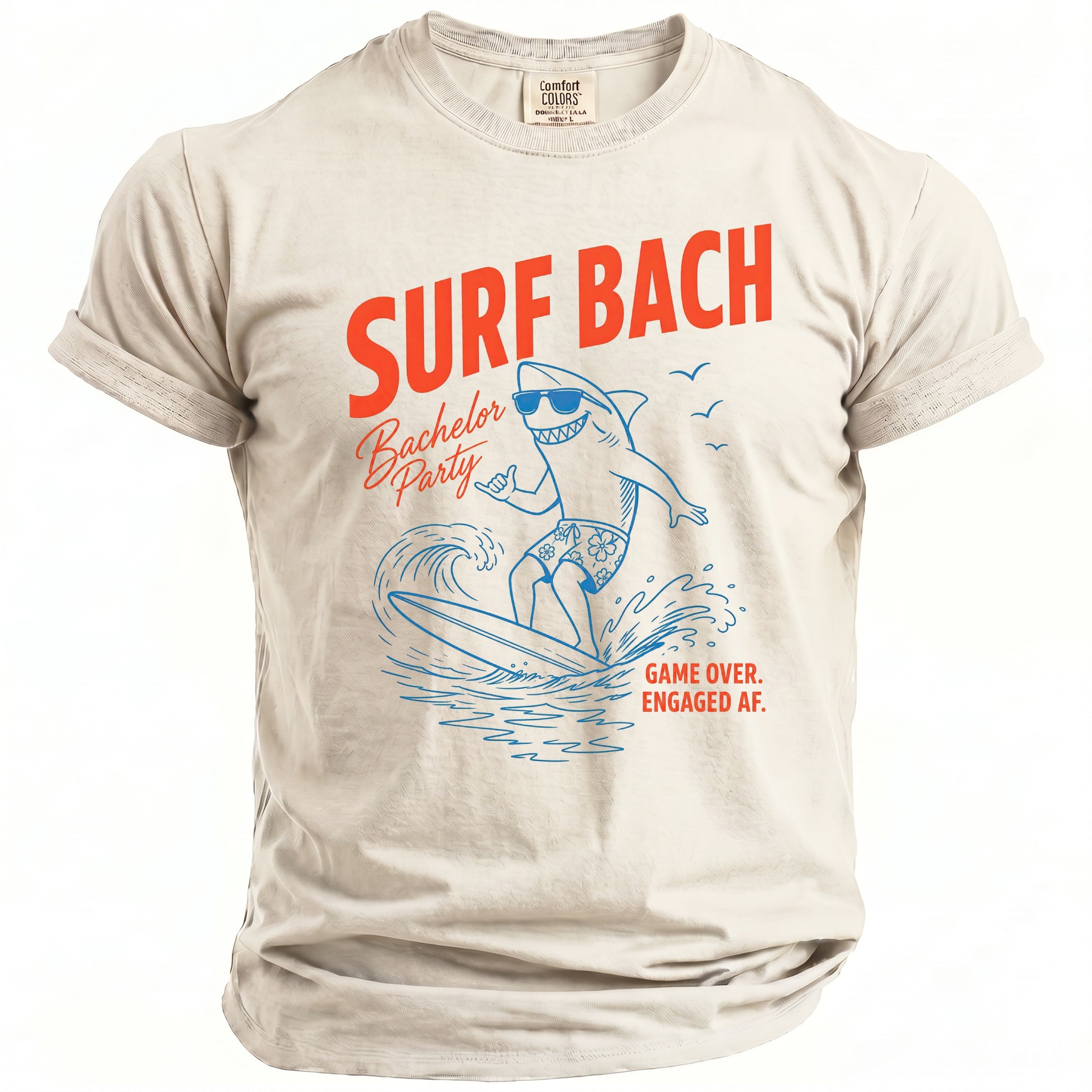 Cream t-shirt with "SURF BACH Bachelor Party" text and surfing shark graphic.