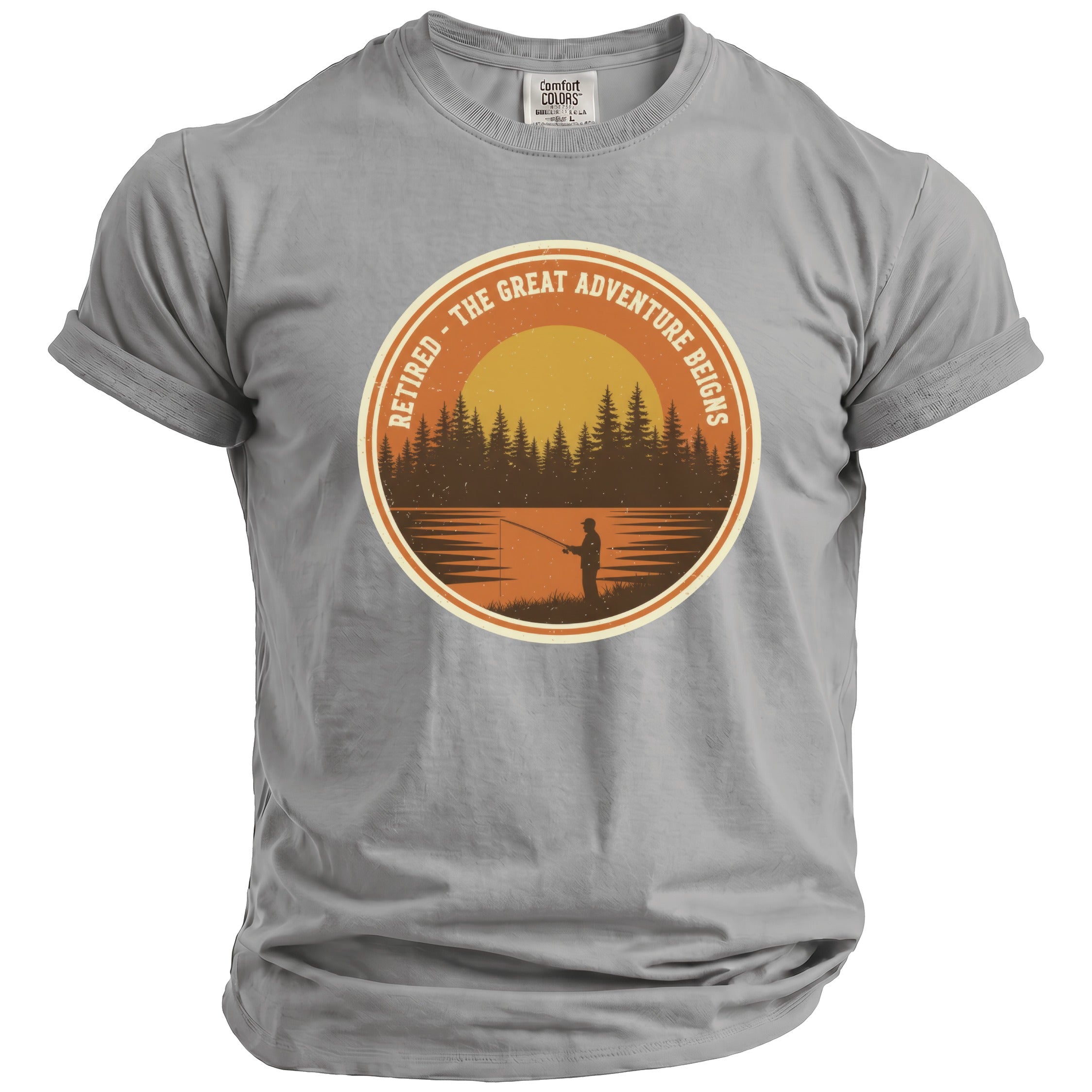 Gray t-shirt with circular graphic of sunset fishing scene and text "RETIRED - THE GREAT ADVENTURE REIGNS".