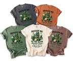 T-shirts featuring a green dragon with a leprechaun hat holding beer, with text.