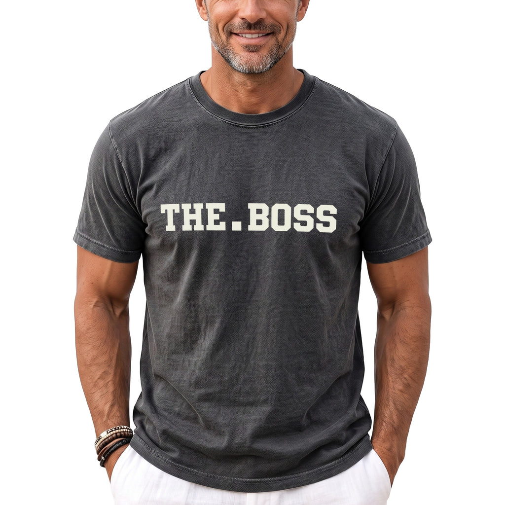 Man wearing a charcoal gray t-shirt with "THE.BOSS" printed on the front.