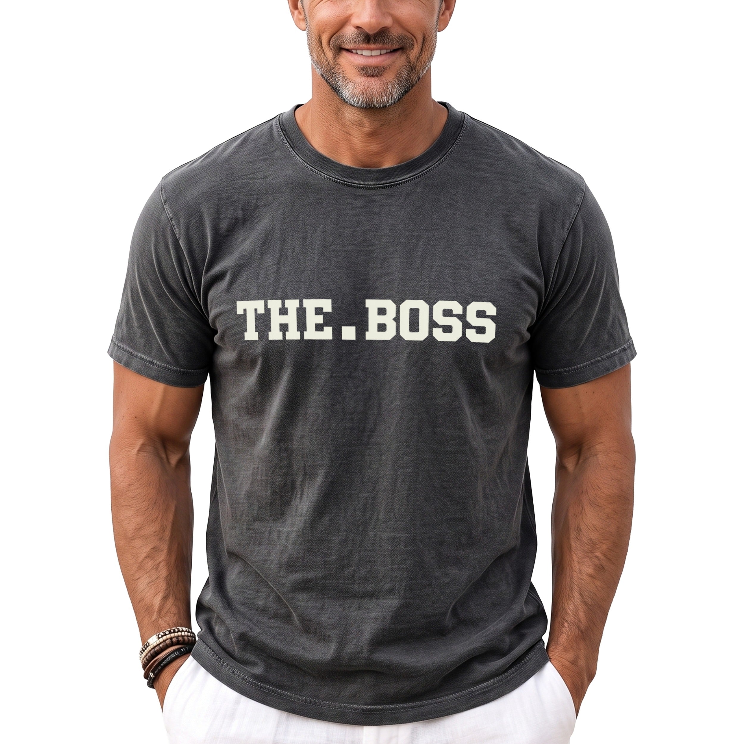 Man wearing a charcoal gray t-shirt with "THE.BOSS" printed on the front.