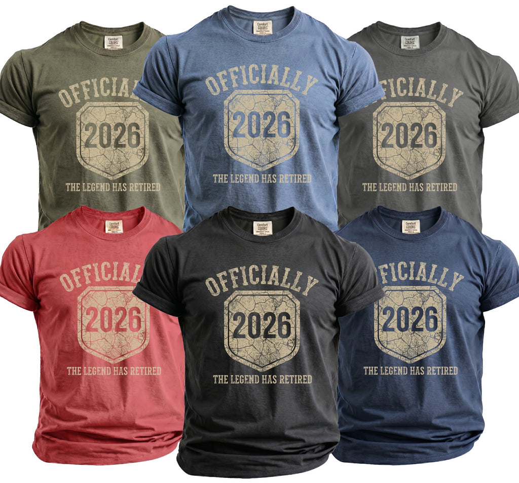 Six t-shirts in various colors, each reading "Officially 2026 The Legend Has Retired".