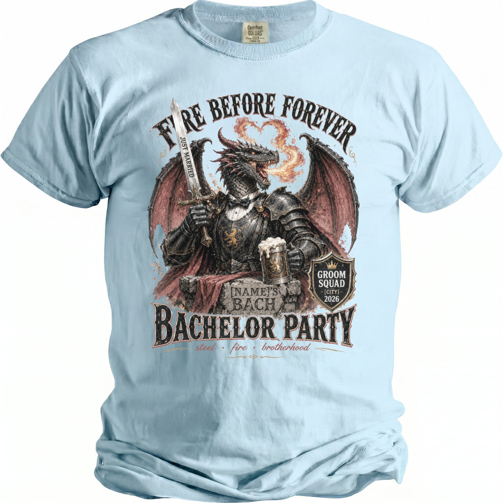 Light blue t-shirt with a dragon graphic and "Fire Before Forever Bachelor Party" text.