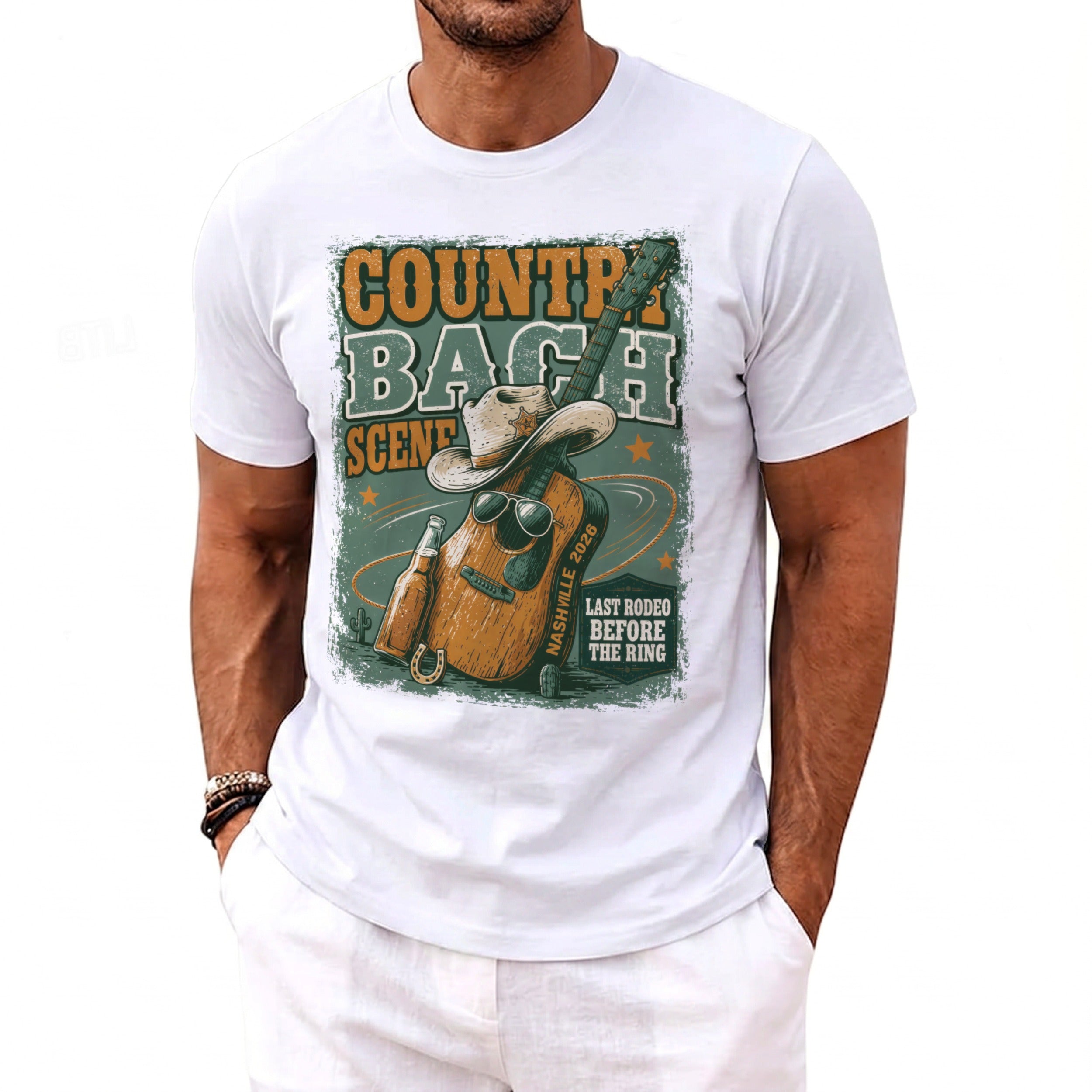 White t-shirt with graphic text "COUNTRY BACH SCENE NASHVILLE 2023" and imagery.