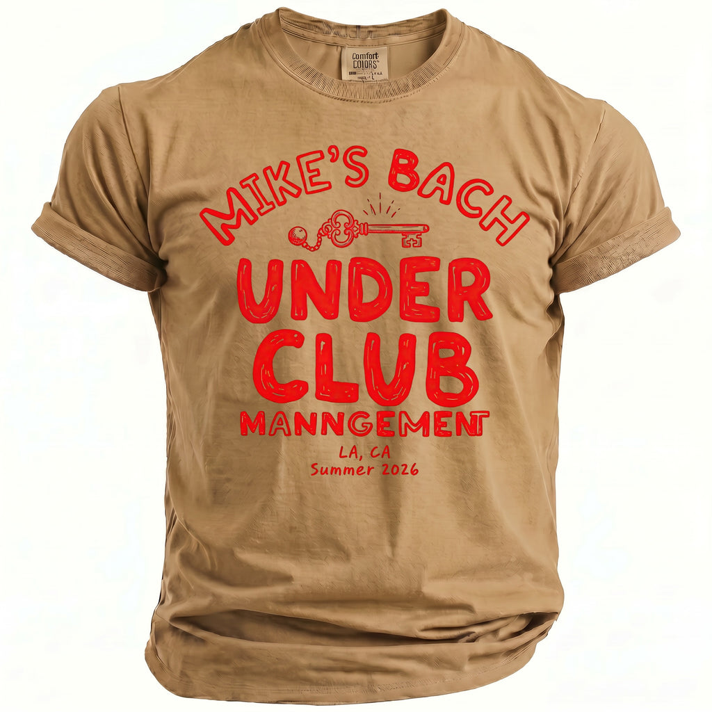 Tan t-shirt with red text: "Mike's Bach Under Club Management LA, CA Summer 2026".