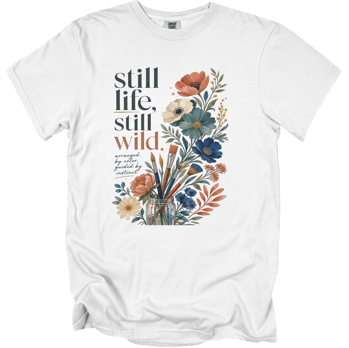 White t-shirt with "still life, still wild." text and floral art.