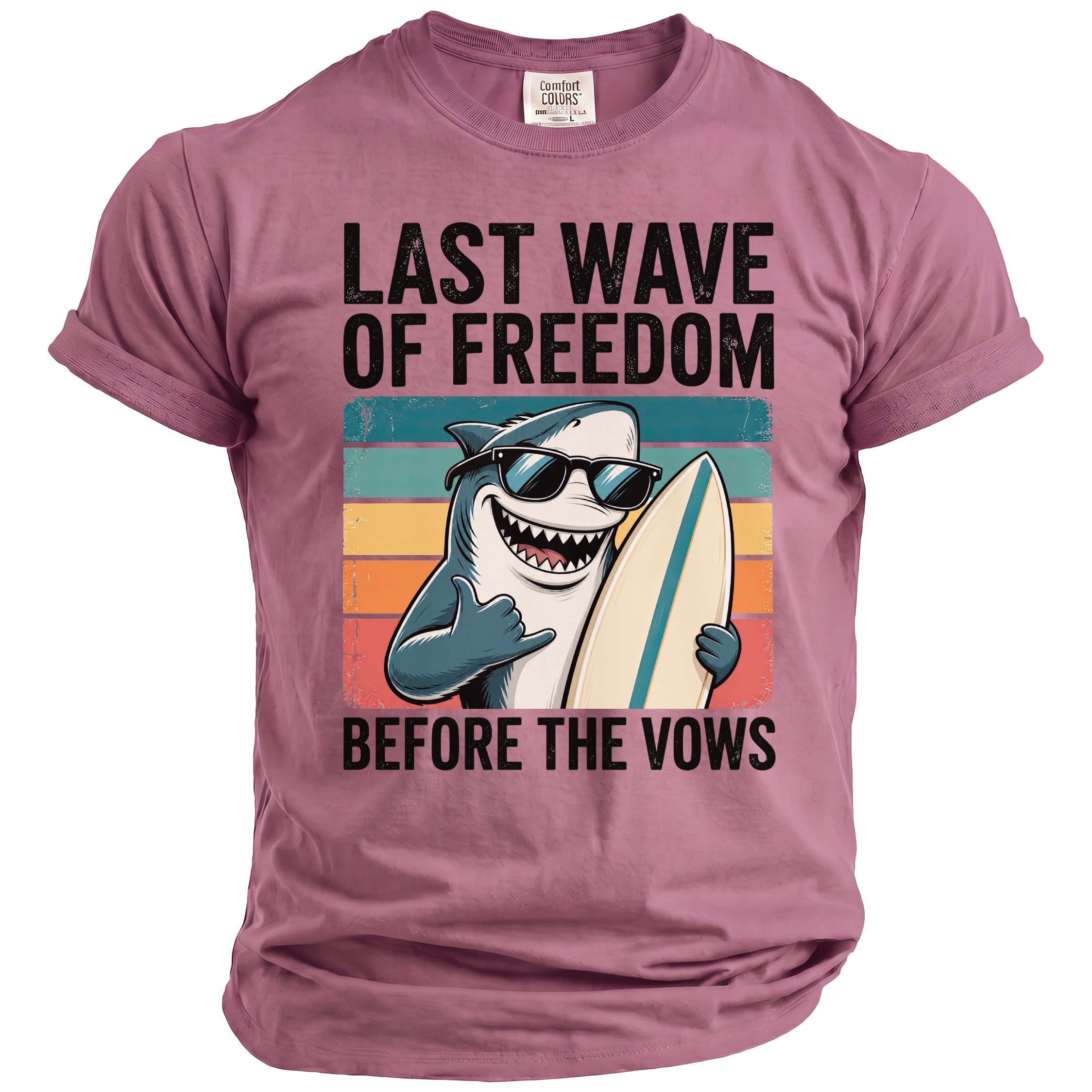 T-shirt with graphic of a shark in sunglasses holding a surfboard, text reads "LAST WAVE OF FREEDOM BEFORE THE VOWS".