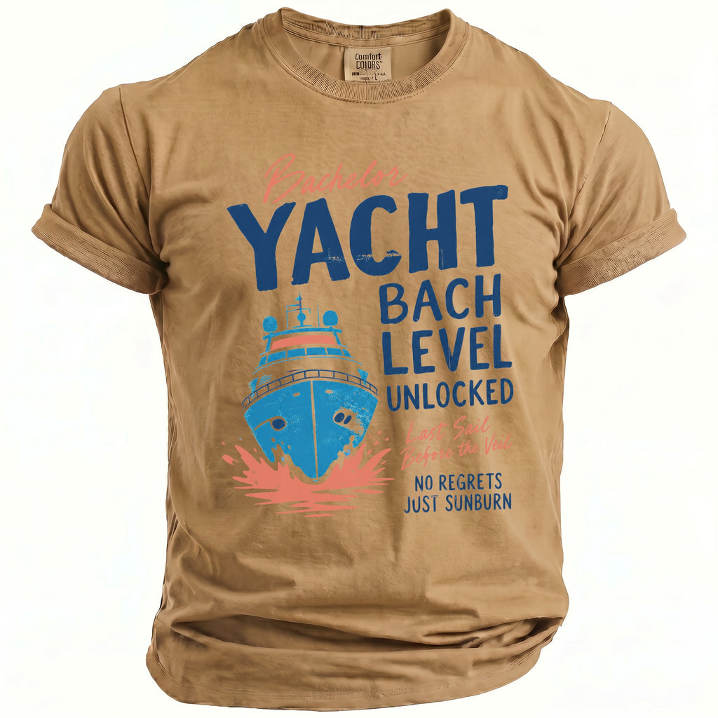 Tan t-shirt with a blue yacht graphic and text "Yacht Bach Level Unlocked".