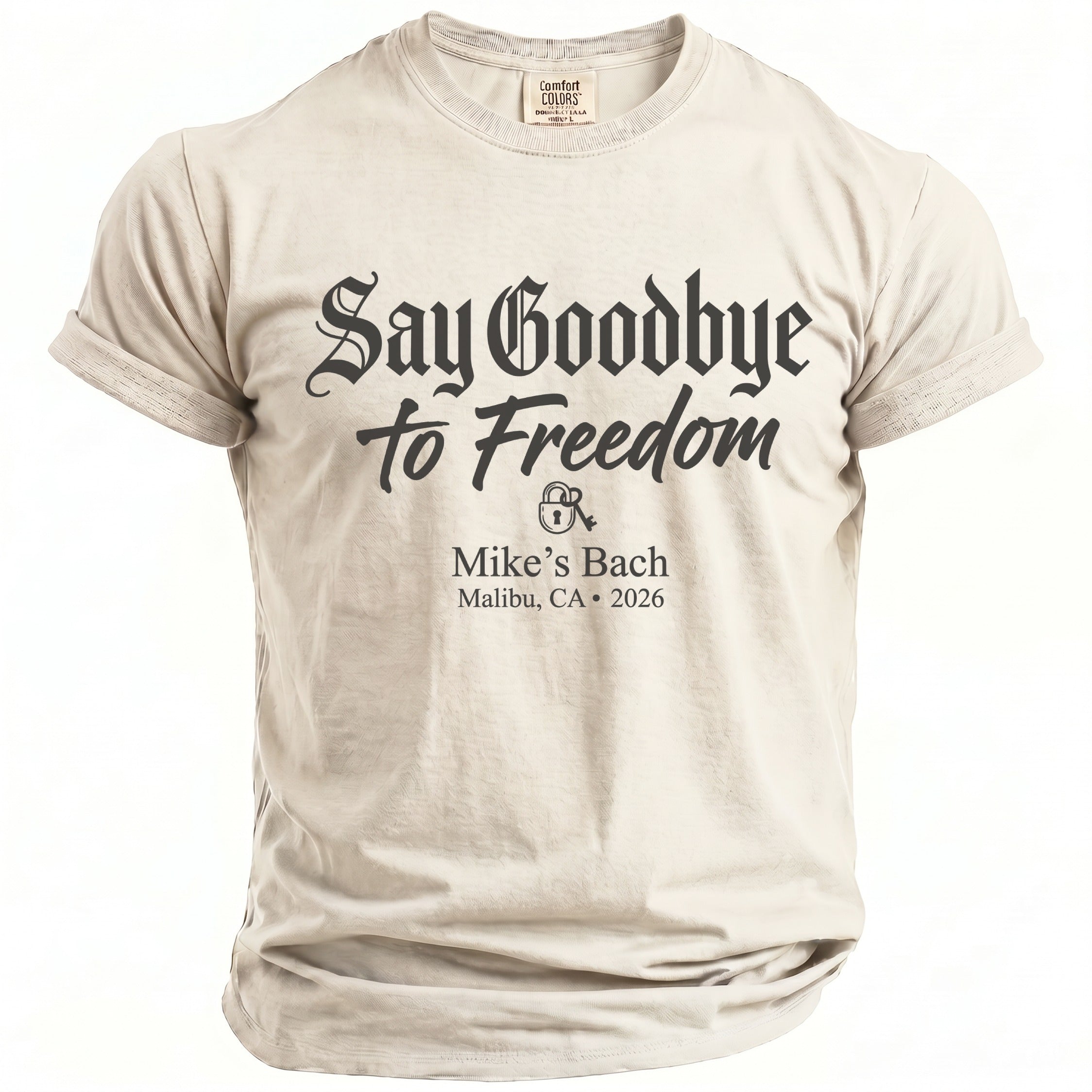 Light tan t-shirt with "Say Goodbye to Freedom Mike's Bach Malibu, CA 2026" text.