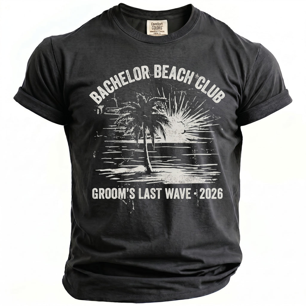 Dark grey t-shirt with "Bachelor Beach Club Groom's Last Wave 2026" graphic.