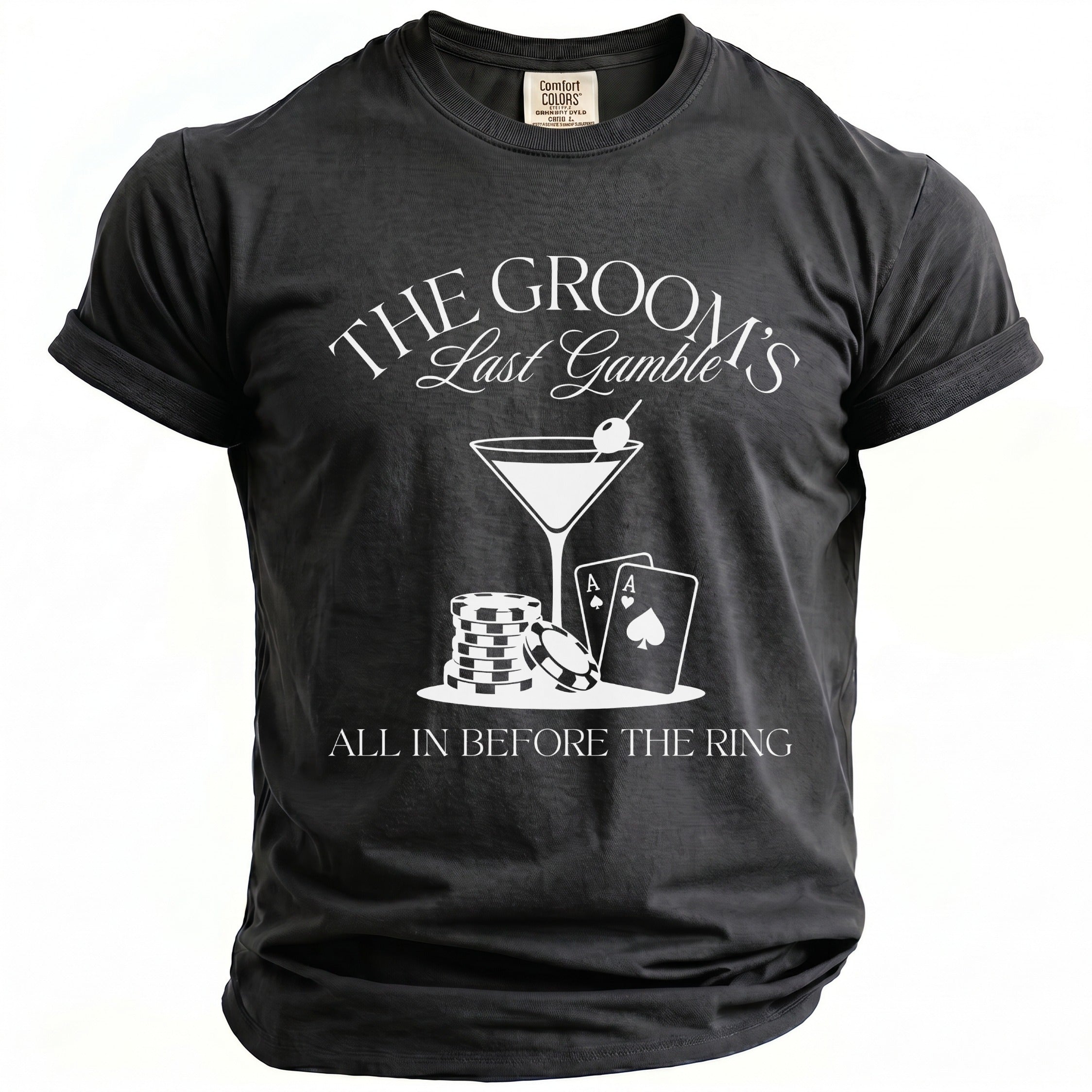 Black t-shirt with white text: "The Groom's Last Gamble" and poker graphics.