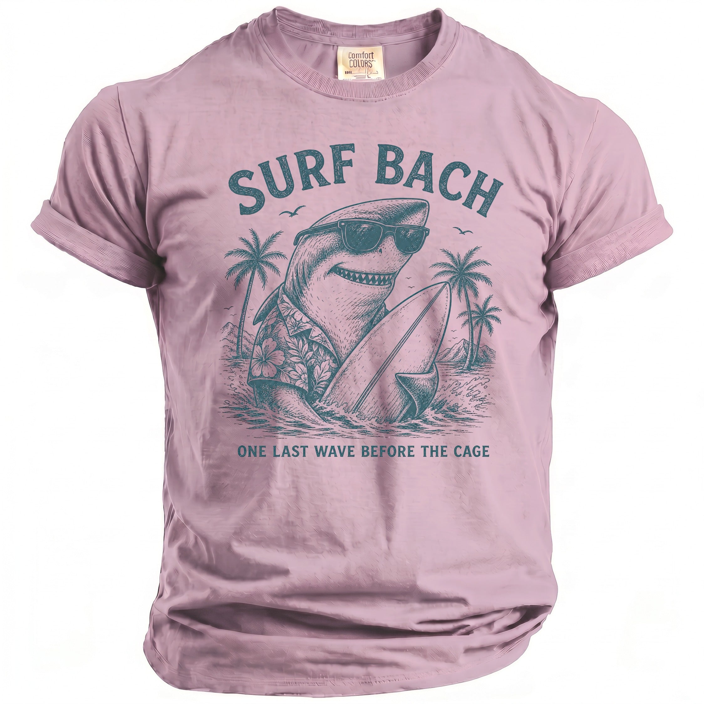Pink t-shirt with graphic of surfing shark with sunglasses and surfboard, "SURF BACH" and "ONE LAST WAVE BEFORE THE CAGE".