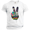 White t-shirt with a peace sign graphic featuring Vegas imagery and text.