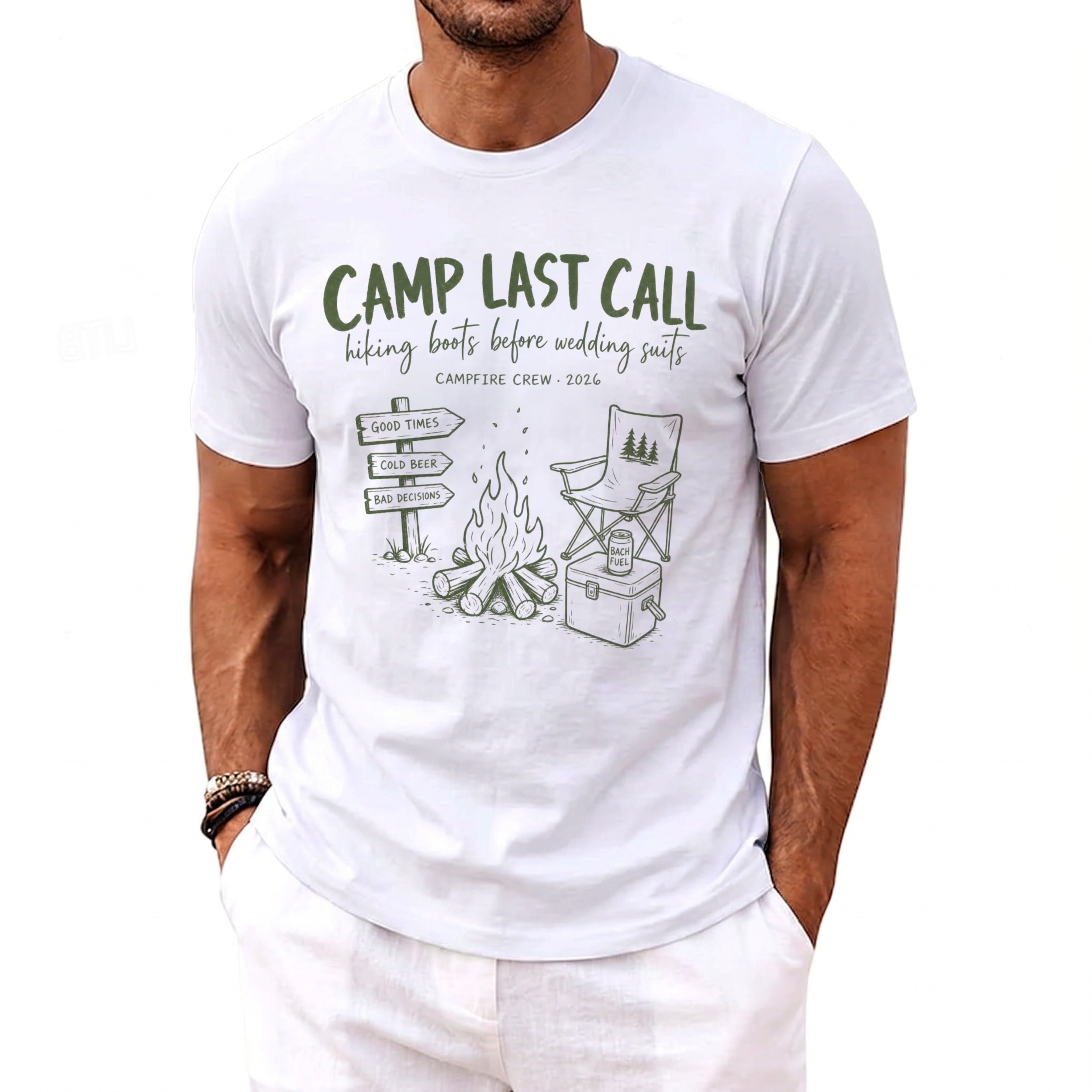 White t-shirt with camping graphic and text: "Camp Last Call, hiking boots before wedding suits".
