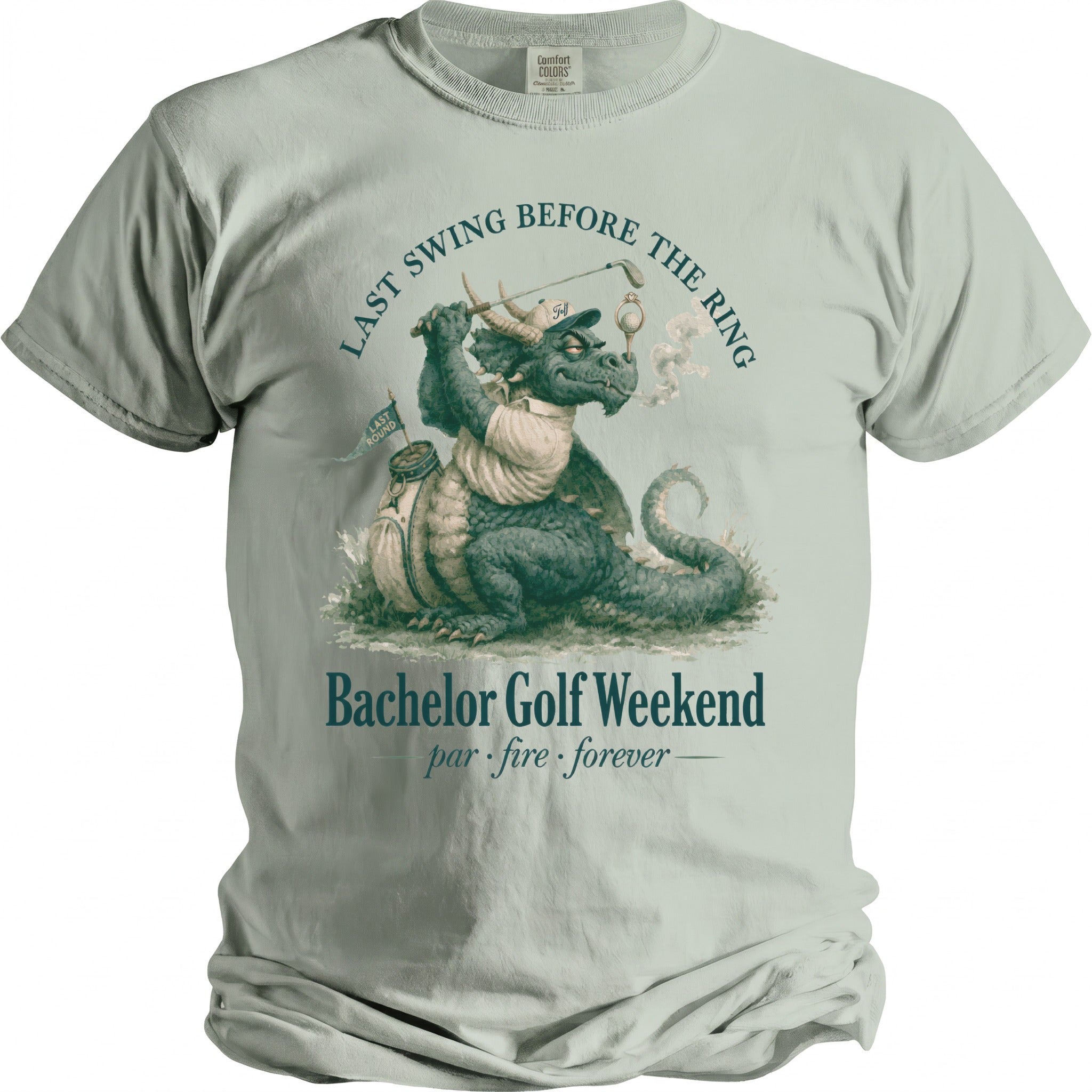 T-shirt graphic of a dragon playing golf with text "LAST SWING BEFORE THE RING".