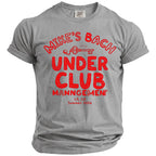 Grey t-shirt with red text "MIKE'S BACH UNDER CLUB MANNGEMENT LA, CA Summer 2026" and a key graphic.