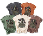 Various colored t-shirts featuring a knight artwork and text for Kenneth's Bach.