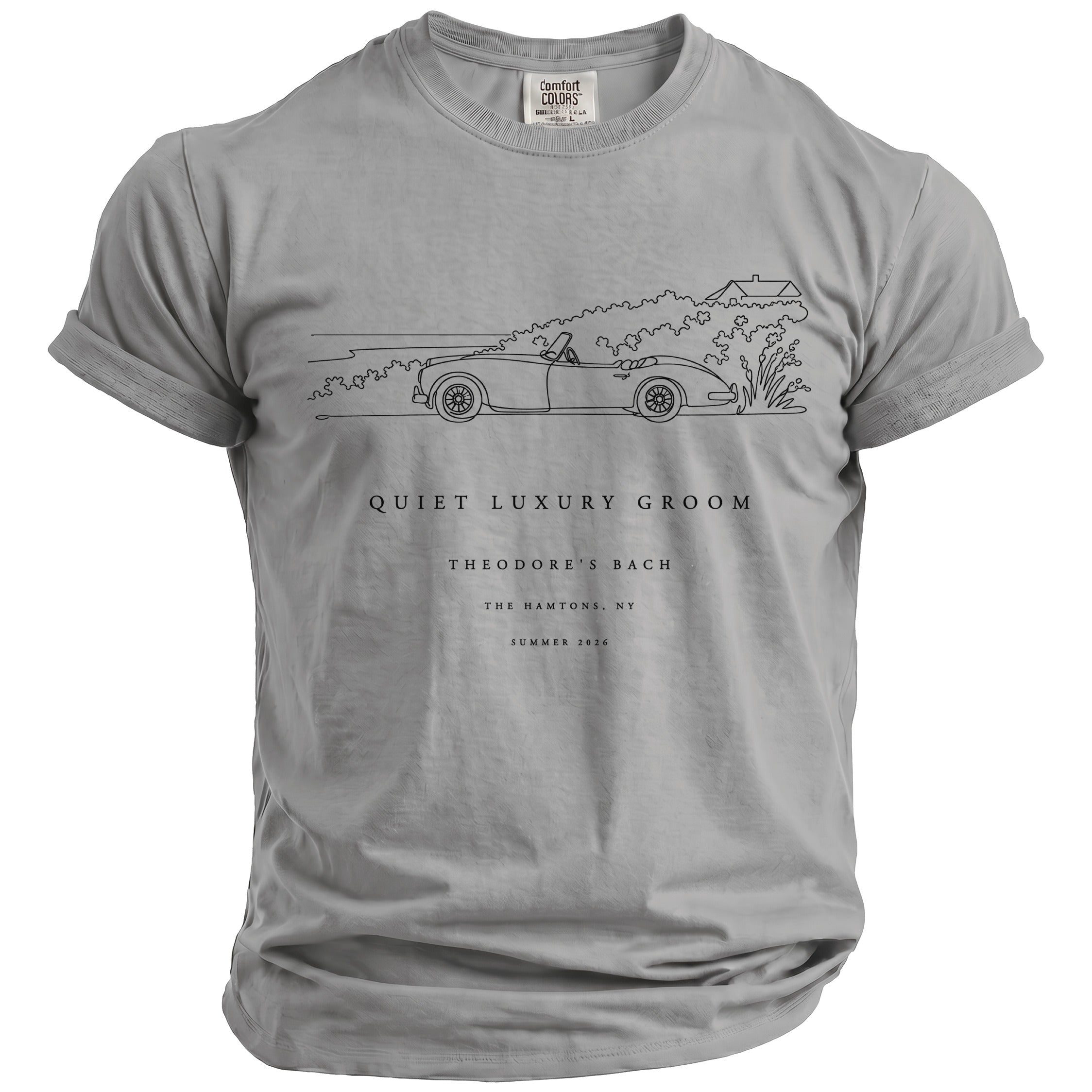 Grey t-shirt with line drawing of a classic car, text "QUIET LUXURY GROOM THEODORE'S BACH".