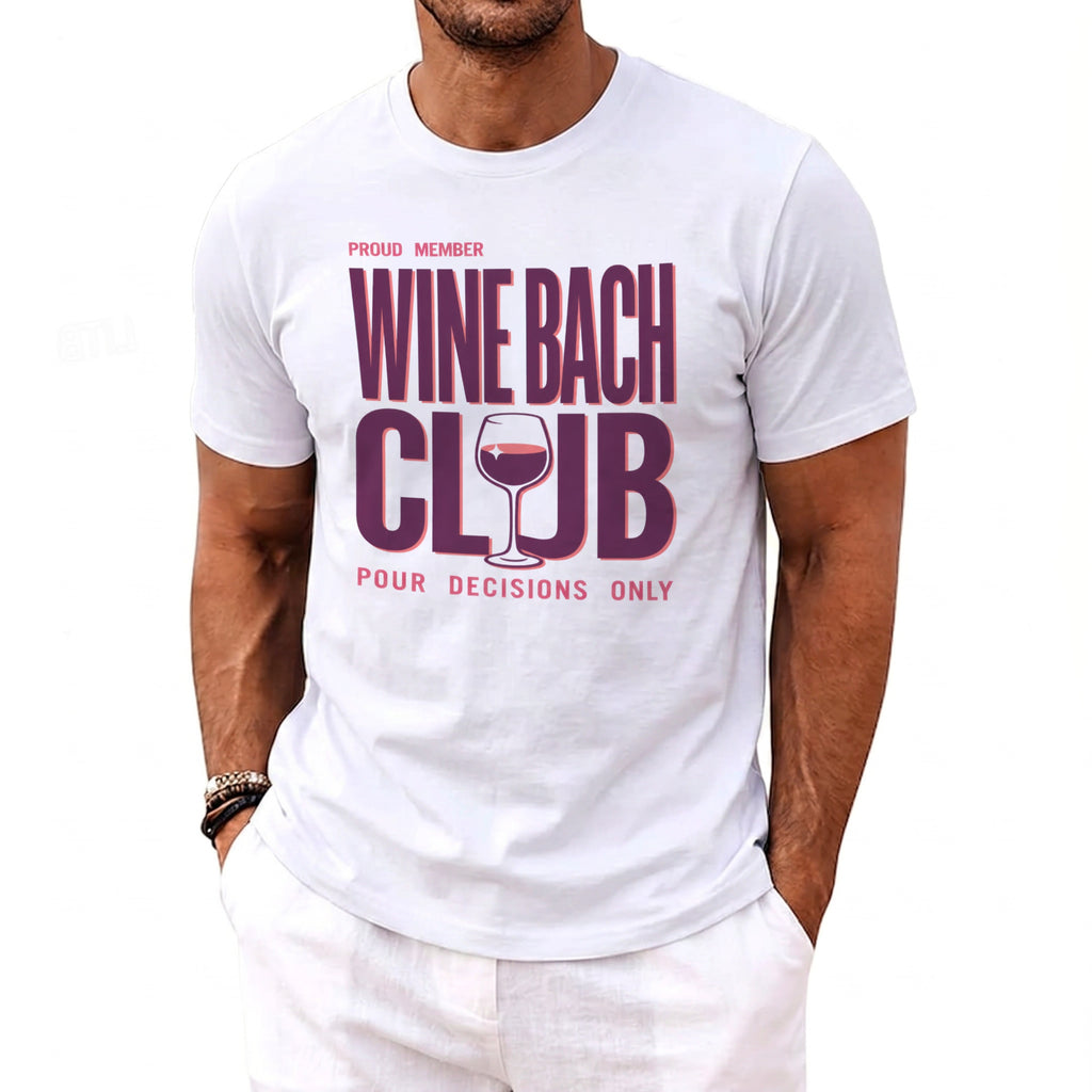 White t-shirt with "Proud Member Wine Bach Club Pour Decisions Only" text and wine glass graphic.