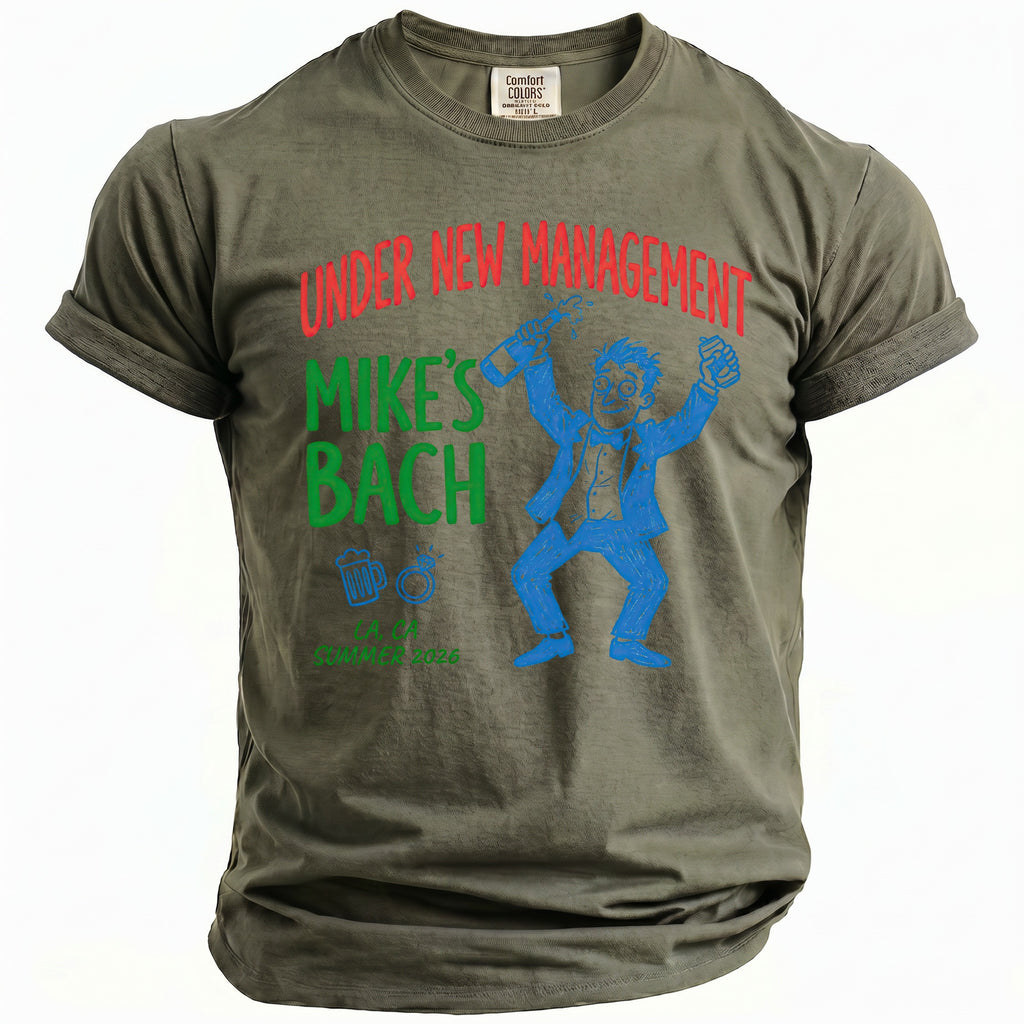 Olive t-shirt with "Under New Management Mike's Bach" and cartoon man.