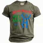 Olive t-shirt with "Under New Management Mike's Bach" and cartoon man.