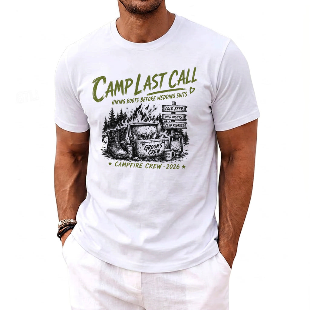 White t-shirt graphic with campfire, cooler, boots, and text "Camp Last Call, Groom's Crew 2026".