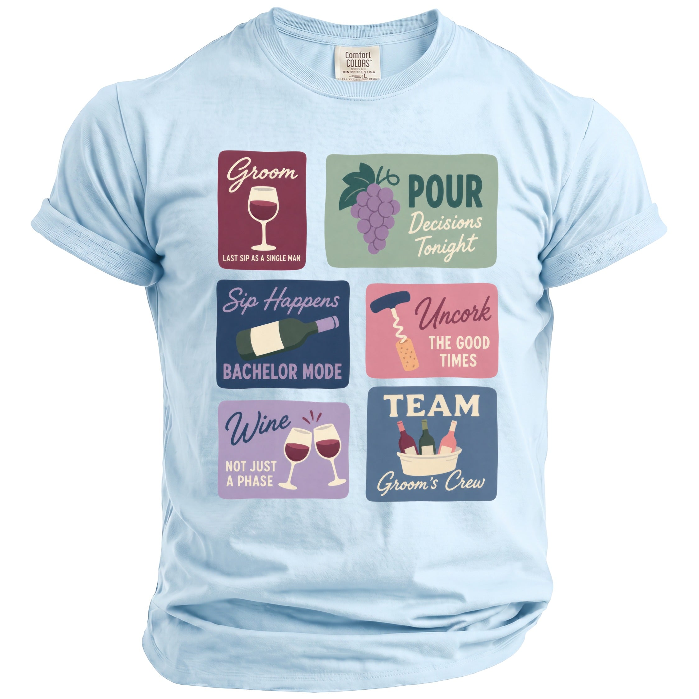 Light blue t-shirt with a graphic featuring six colorful squares with wine-themed text and illustrations.