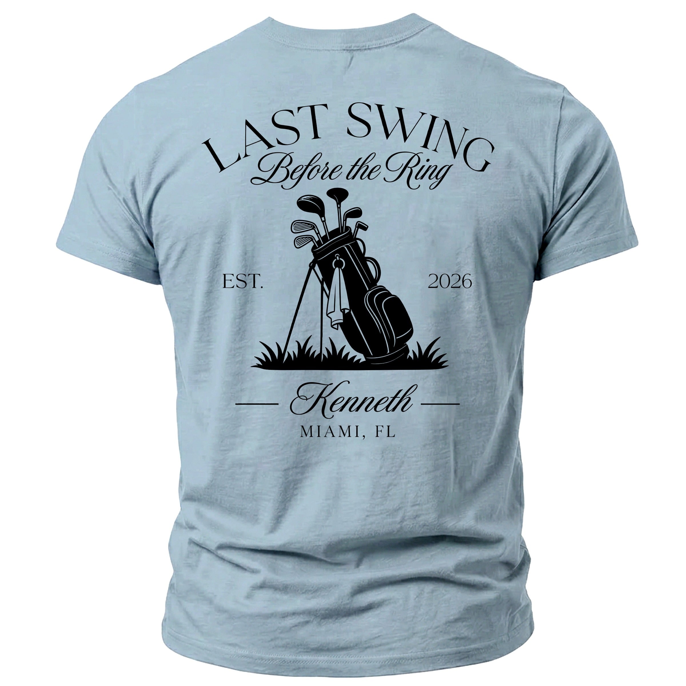 Light blue t-shirt with "Last Swing Before the Ring" and golf imagery.