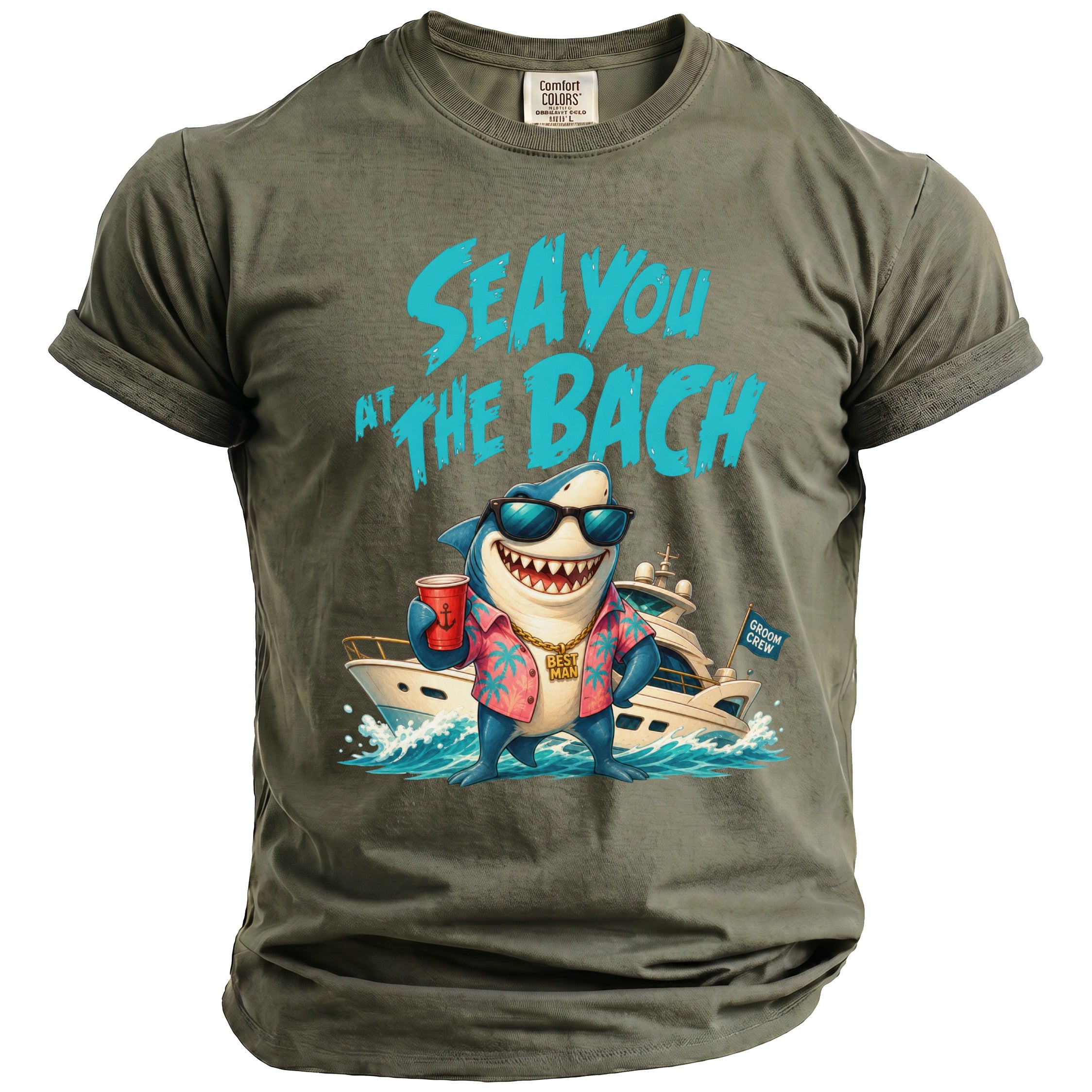 An olive green crewneck t-shirt with a graphic of a shark wearing sunglasses and a tropical shirt in front of a yacht, with the text SEA YOU AT THE BACH.