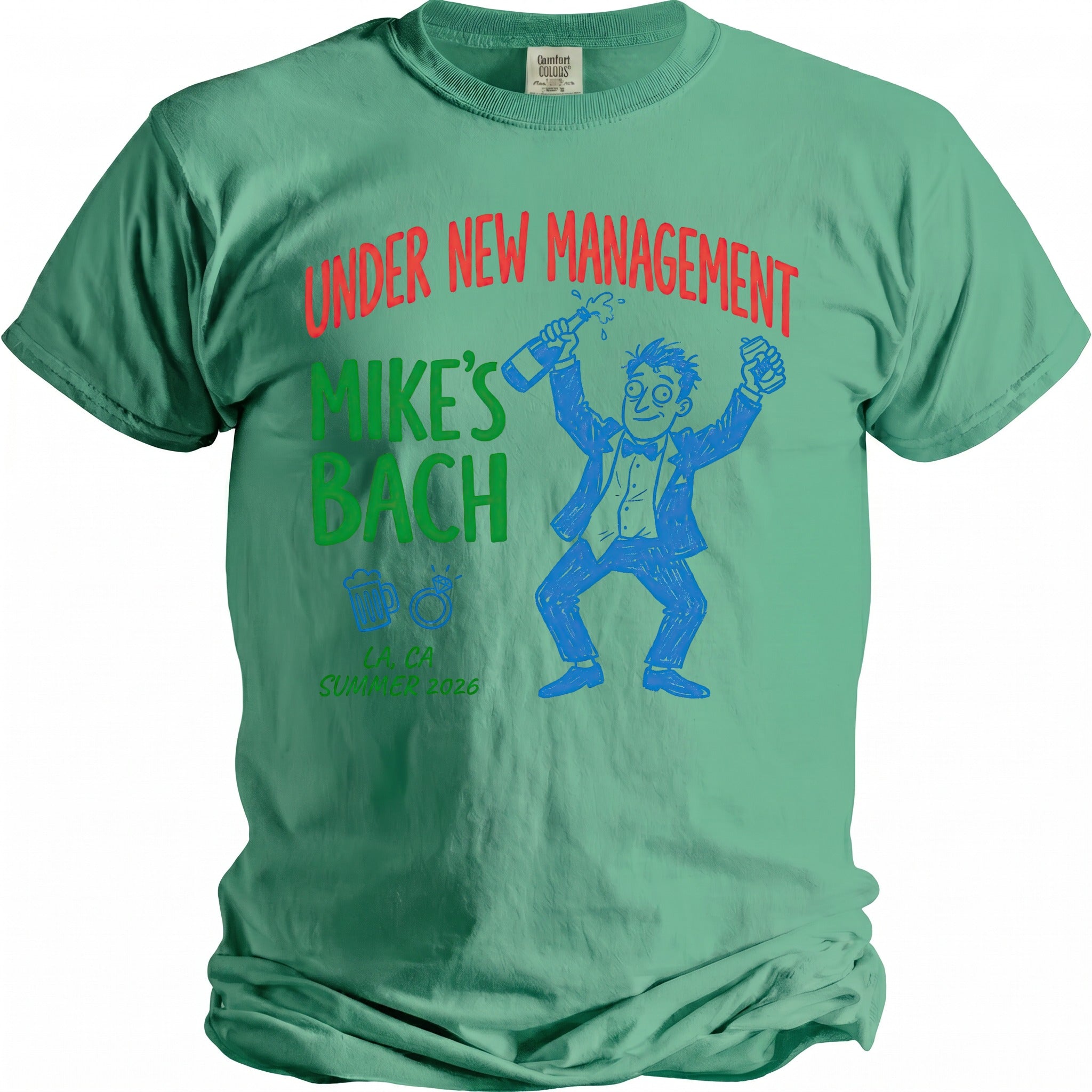 Green t-shirt with "Under New Management Mike's Bach" text and cartoon graphics.
